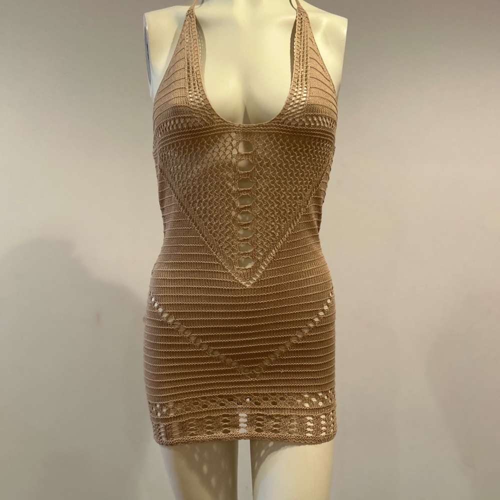 Swimsuit cover-up open back ties at the neck.  Never worn